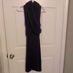 Purple sleeveless dress that is about knee length.